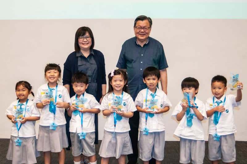 Children receiving recognition awards at the Trilingual Fest