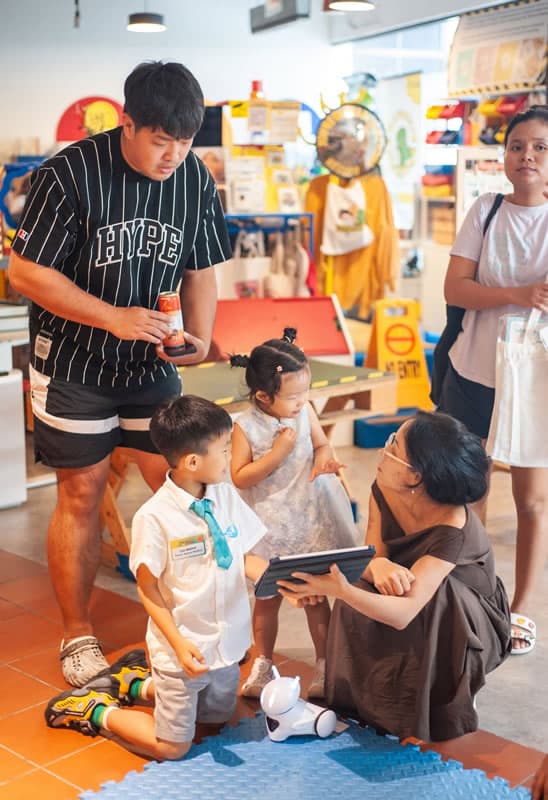 A family trying the screen-free mTiny robot activity